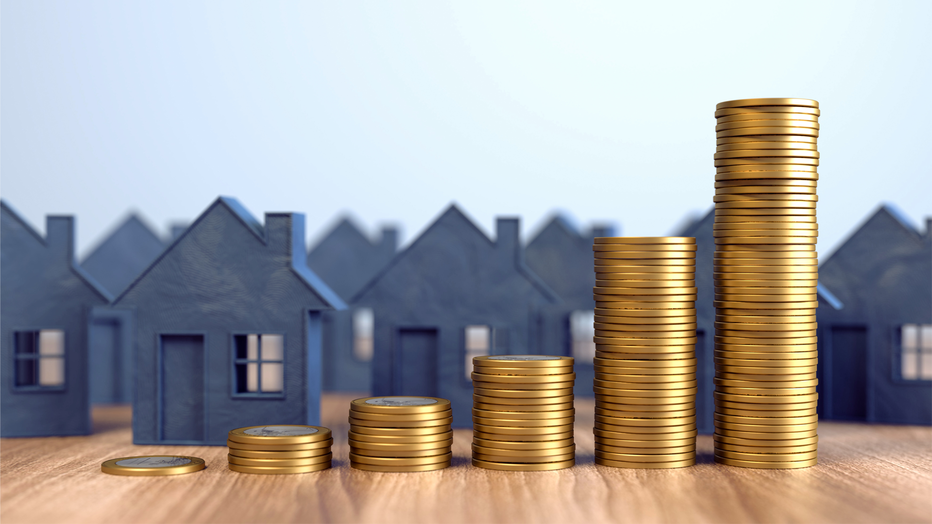ENAHO. Ilustración. Fila de casas grises en miniatura, con torres de monedas doradas al frente.